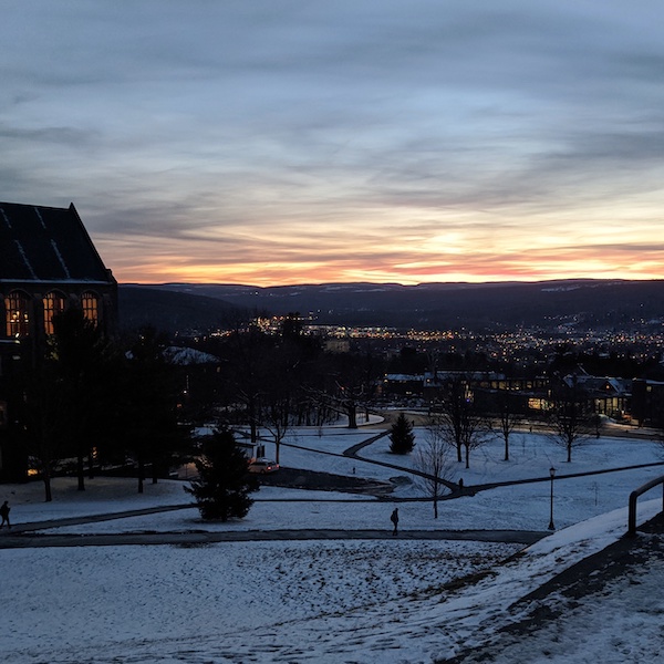 A photograph of Cornell University campus at sunset in winter