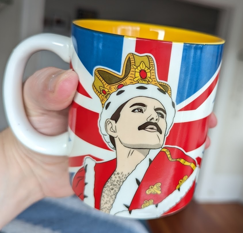 A mug with a picture of Freddie Mercury wearing a crown