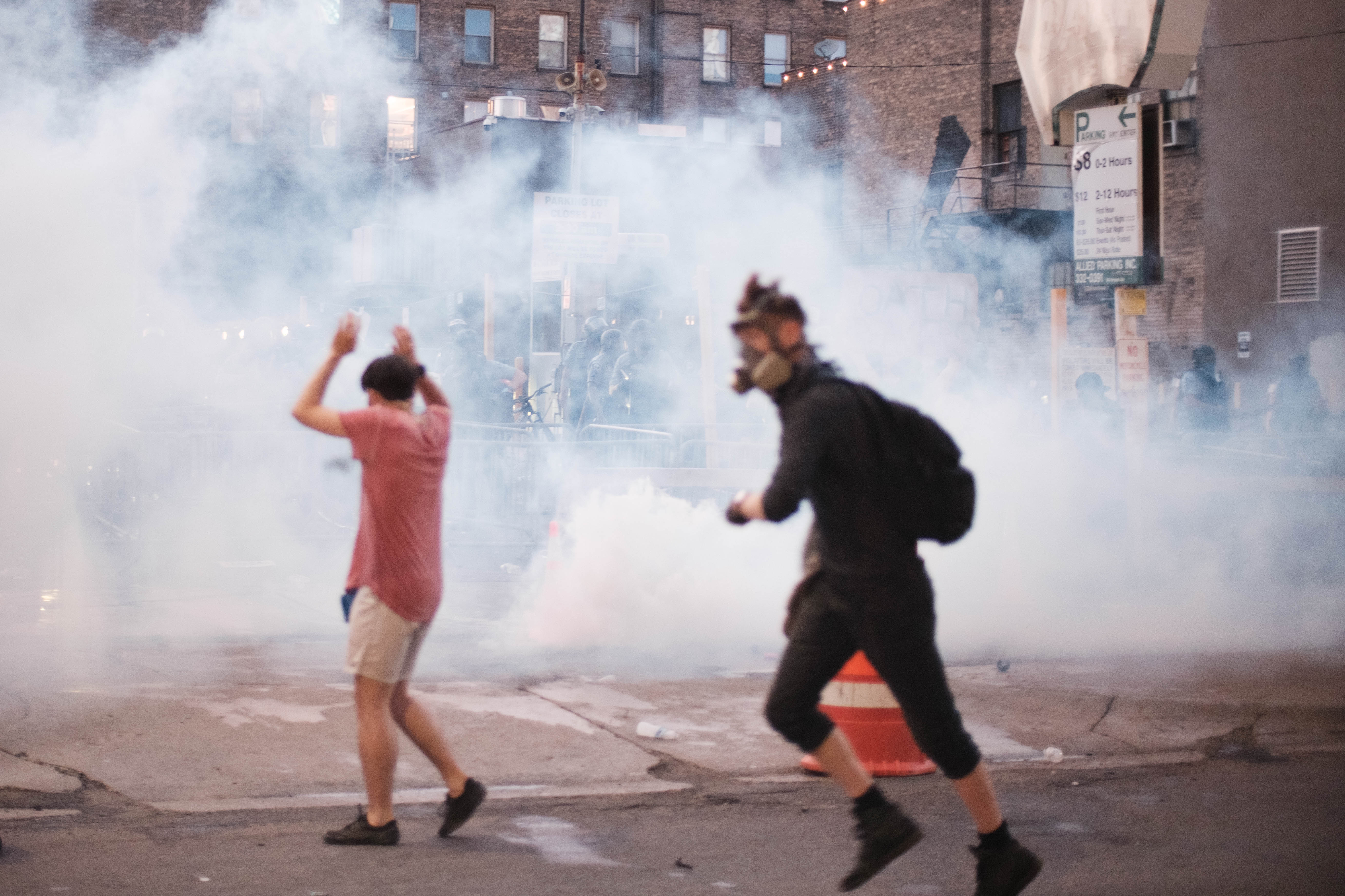 Pouring milk into the eyes of a protestor who is laying down